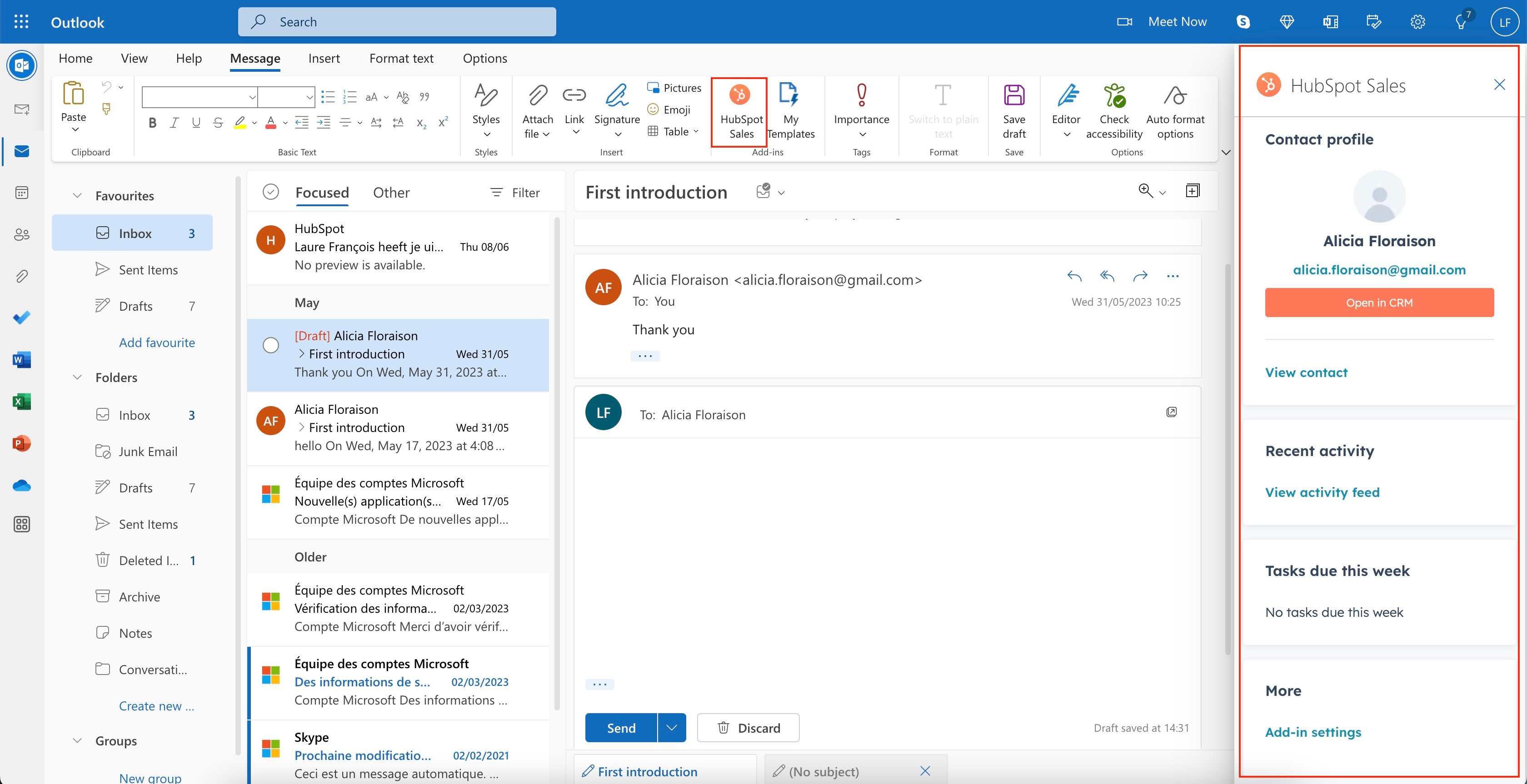 screenshot of the Outlook interface with the HubSpot integration elements highlighted, such as the HubSpot logo and the contact information section. 
