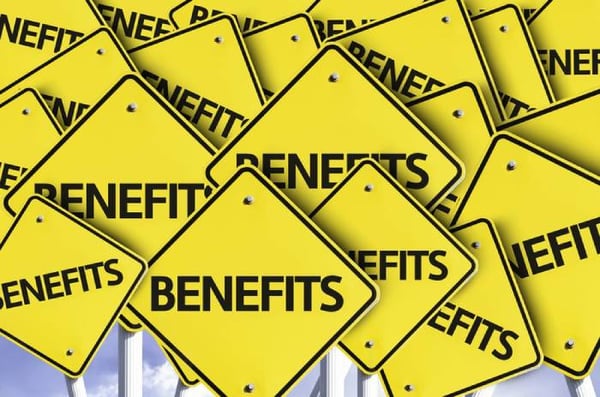 Benefits written on multiple road sign - Hubspot perks