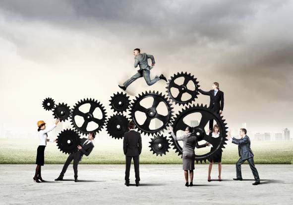 Conceptual image of businessteam working cohesively. Interaction and unity required in CRM change management