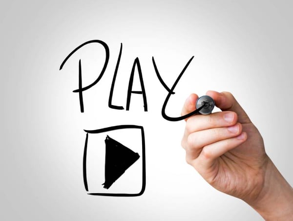 Hand writing with a black mark on a transparent wipe board - Play the video